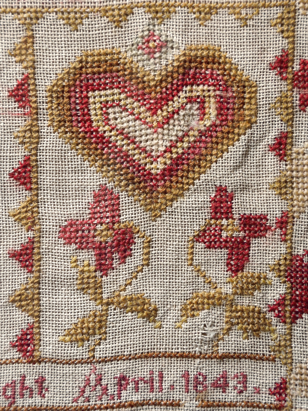Antique heart sampler motif