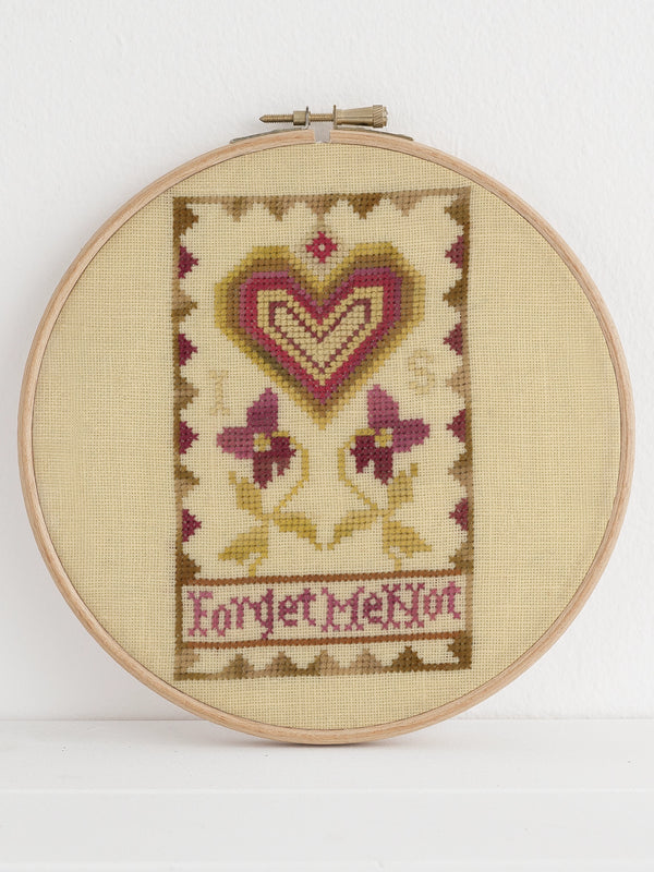 Antique heart sampler motif